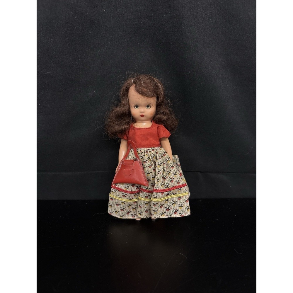 Vintage Nancy Ann Storybook doll‎ includes a fabric dress and a small purse